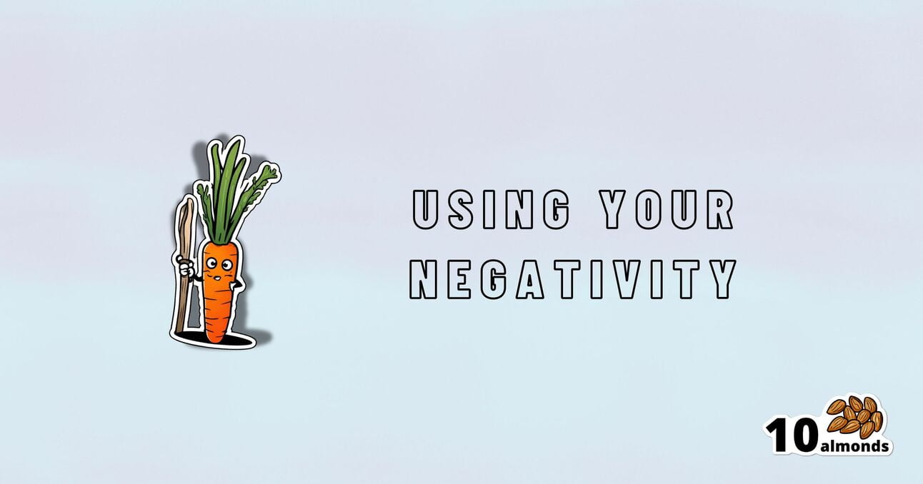 Illustration of an angry carrot holding a fork on the left side, with the text "Using Your Negativity" in bold letters on the right side. The number "10" and an image of almonds are at the bottom right corner. The background is light blue, emphasizing how to harness negativity for productivity.